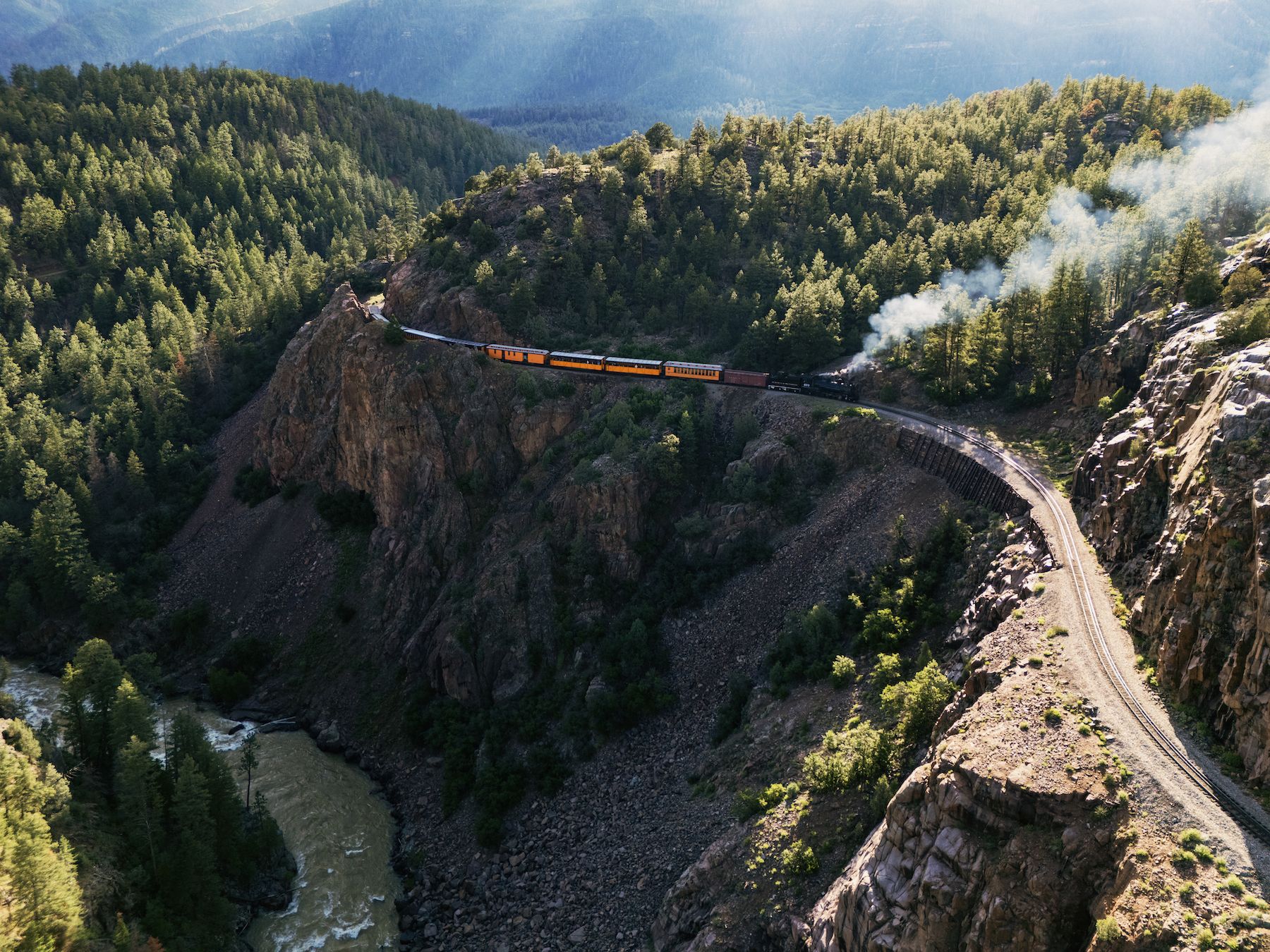 Steam Engine rounding the bend around the canyon